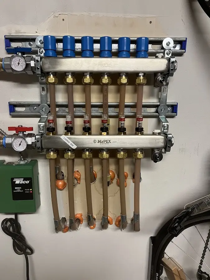 Plumber performing Water Heater Repair at a residential property in Newark Valley